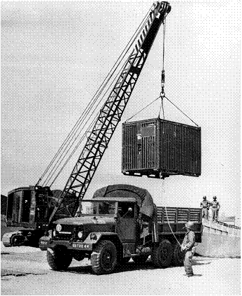 Conex box hoisted onto US army truck