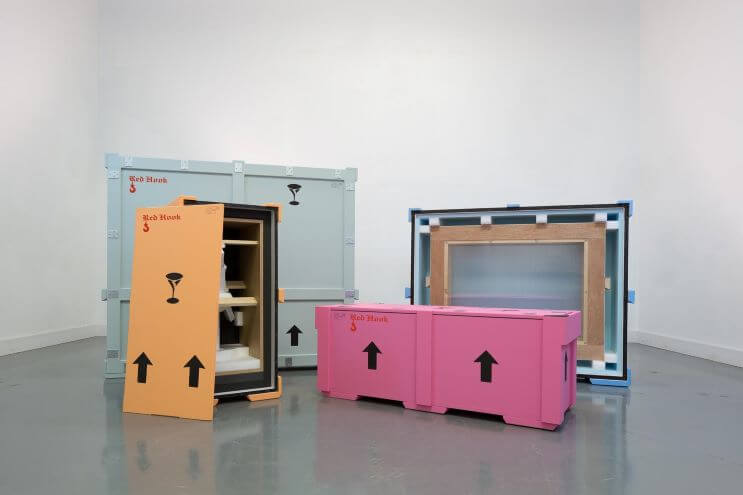 Picture showing how one does transport fine art. Metal boxes are used, making sure the packaging is safe for seamless transportation. In this picture, a packaging by Red Hook Crating is shown. For art transportation, they use shipment optimizing software EasyCargo.