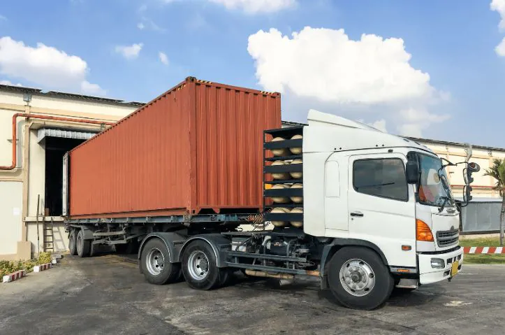 A loaded truck leaving the loading dock