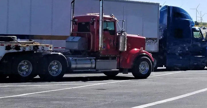 Red semi-truck used for Less-Than-Truckload freight shipping in the U.S.